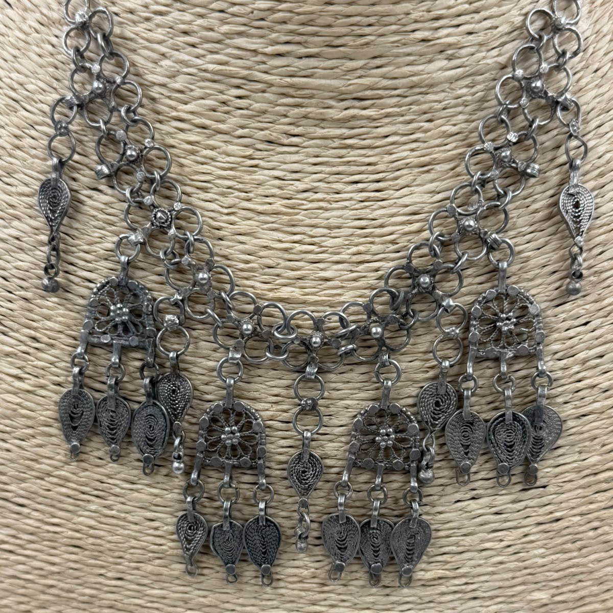 Antique Yemeni silver filigree necklace on scale showing 32.66g weight