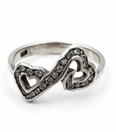 Sterling silver 925 double heart ring with crystal zircon on marble surface