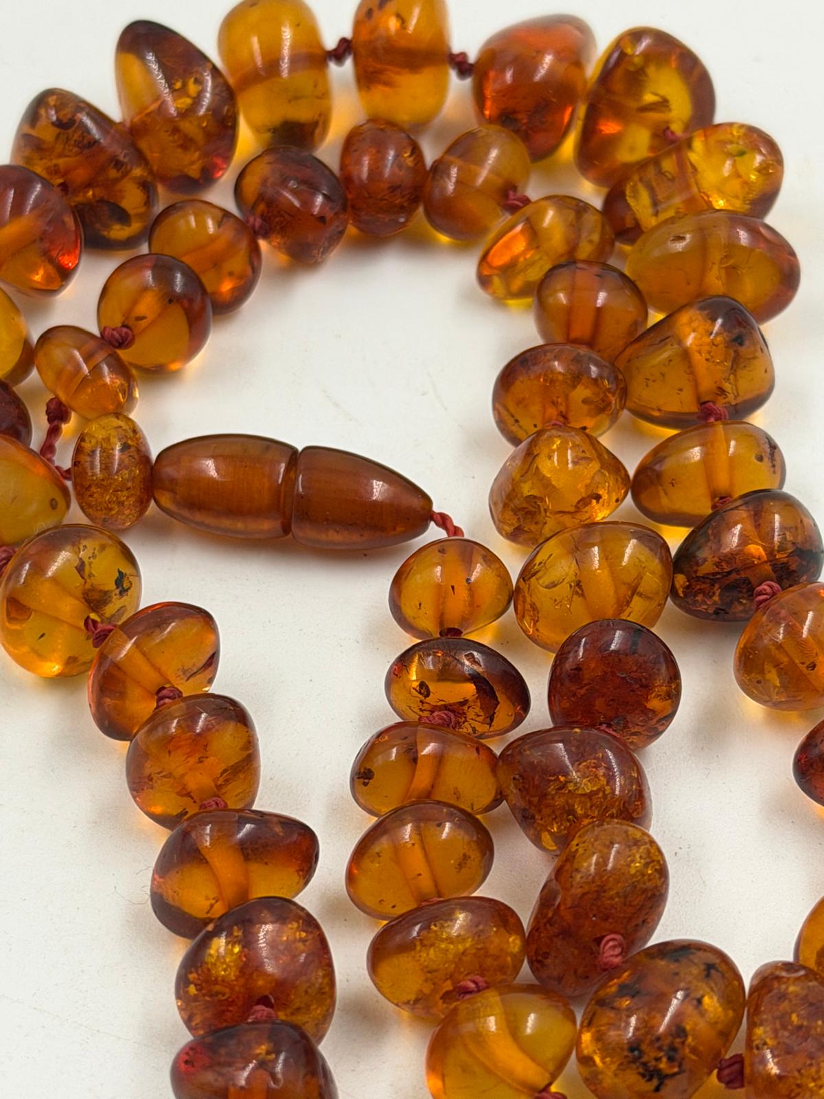 Close-up of amber-like beads showing natural inclusions