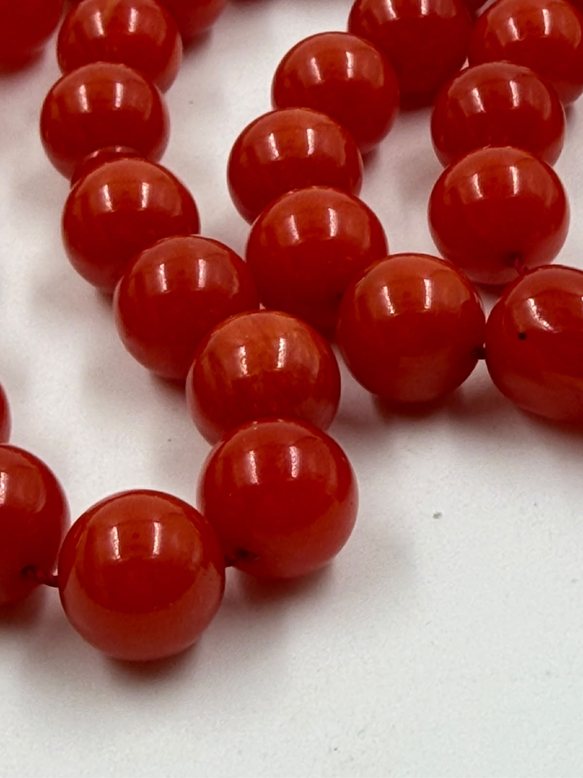 Turkish Faturan prayer beads 33 beads 12mm deep red-orange on white background full view