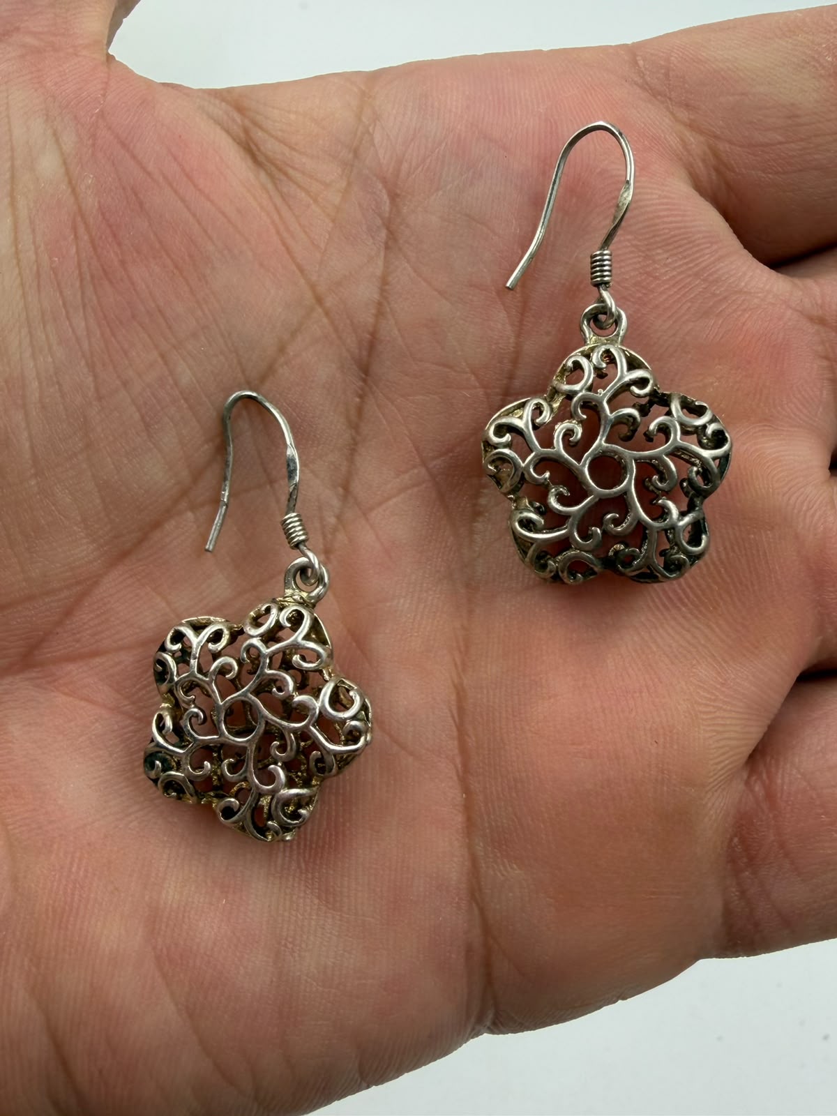 925 silver filigree flower earring close-up macro showing 3D hollow dome and scrollwork detail