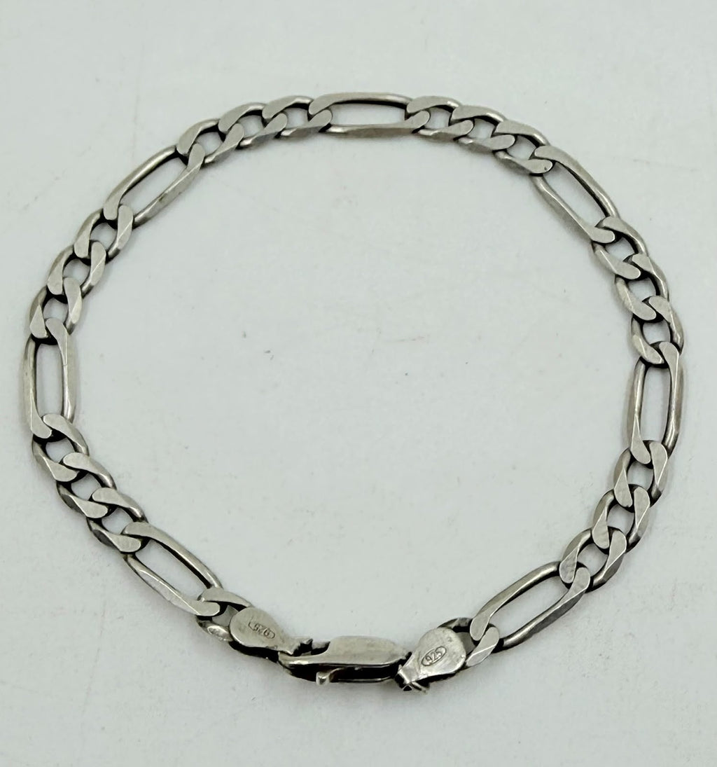Silver Figaro bracelet with ruler showing 20cm length