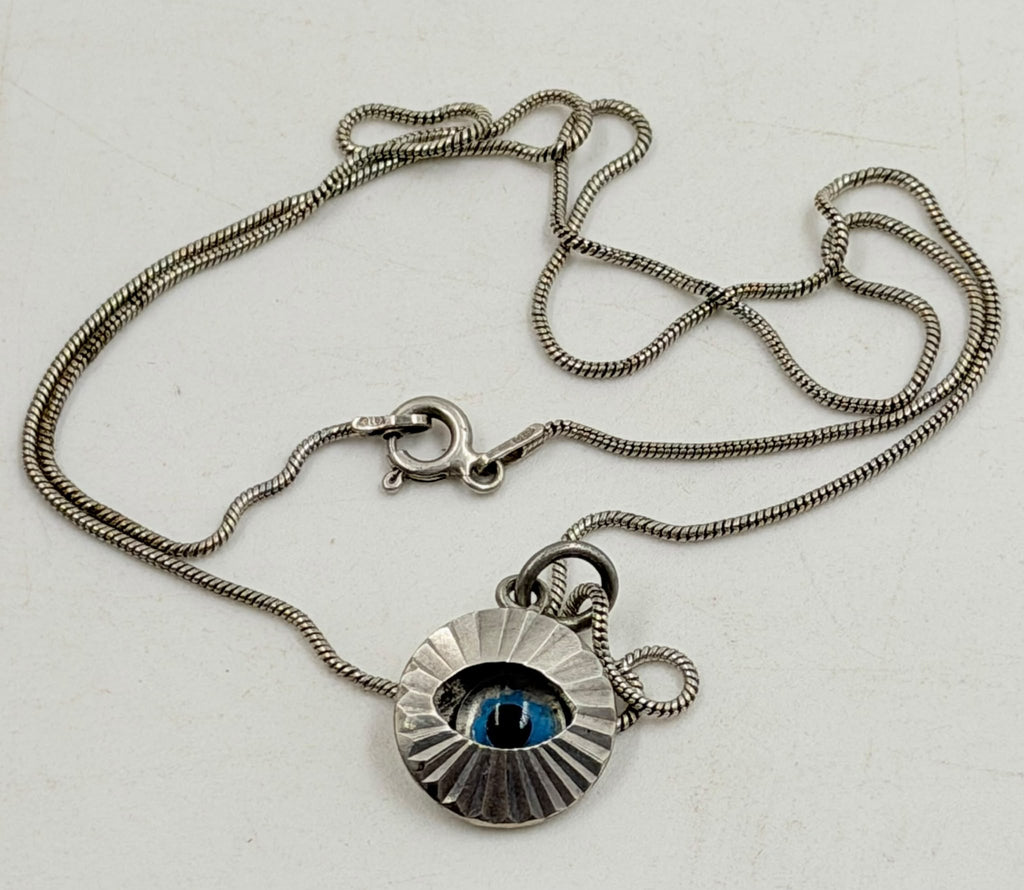 925 Italian sterling silver evil eye necklace held in hand
