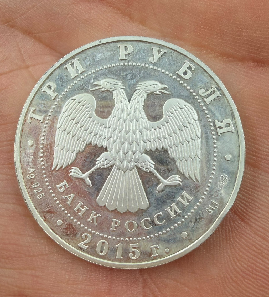 Coin in blue case with COA visible - reverse side showing