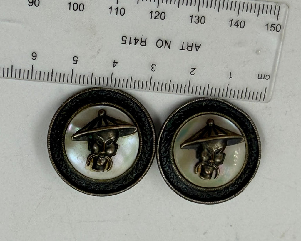 Soviet era brass mother of pearl cufflinks - front view held in hand showing both faces