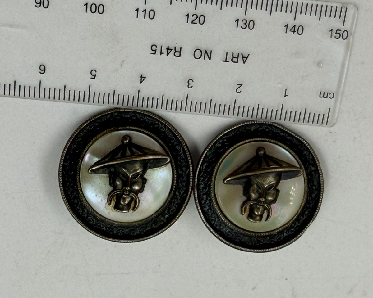 Soviet era brass mother of pearl cufflinks - front view held in hand showing both faces