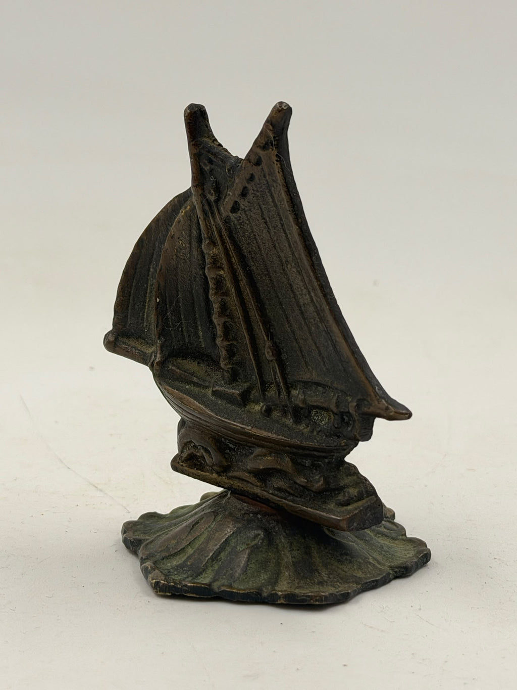 Antique brass sailboat figurine – front left angle