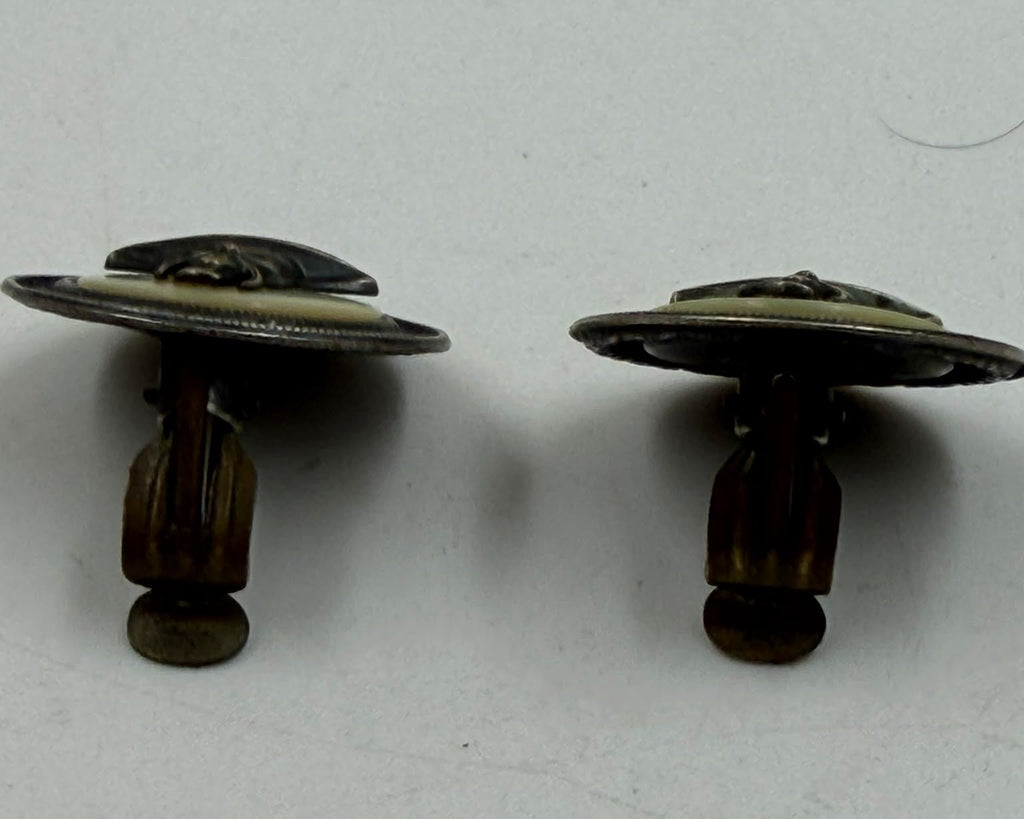 Soviet era cufflinks - pair held in palm close-up