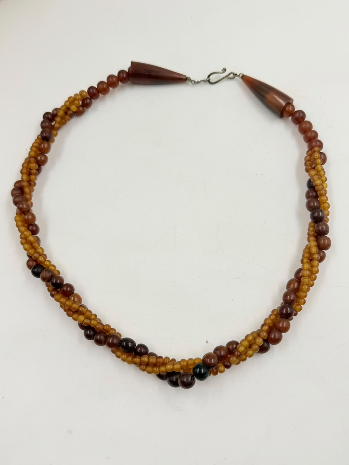 Mixed amber bead textures macro closeup