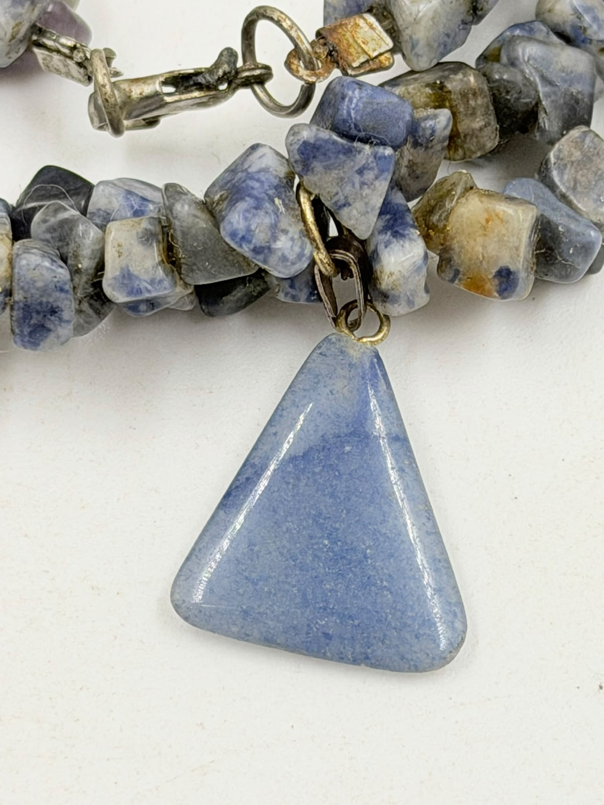 Natural sodalite chip necklace on wicker bust - double strand with triangle pendant front view