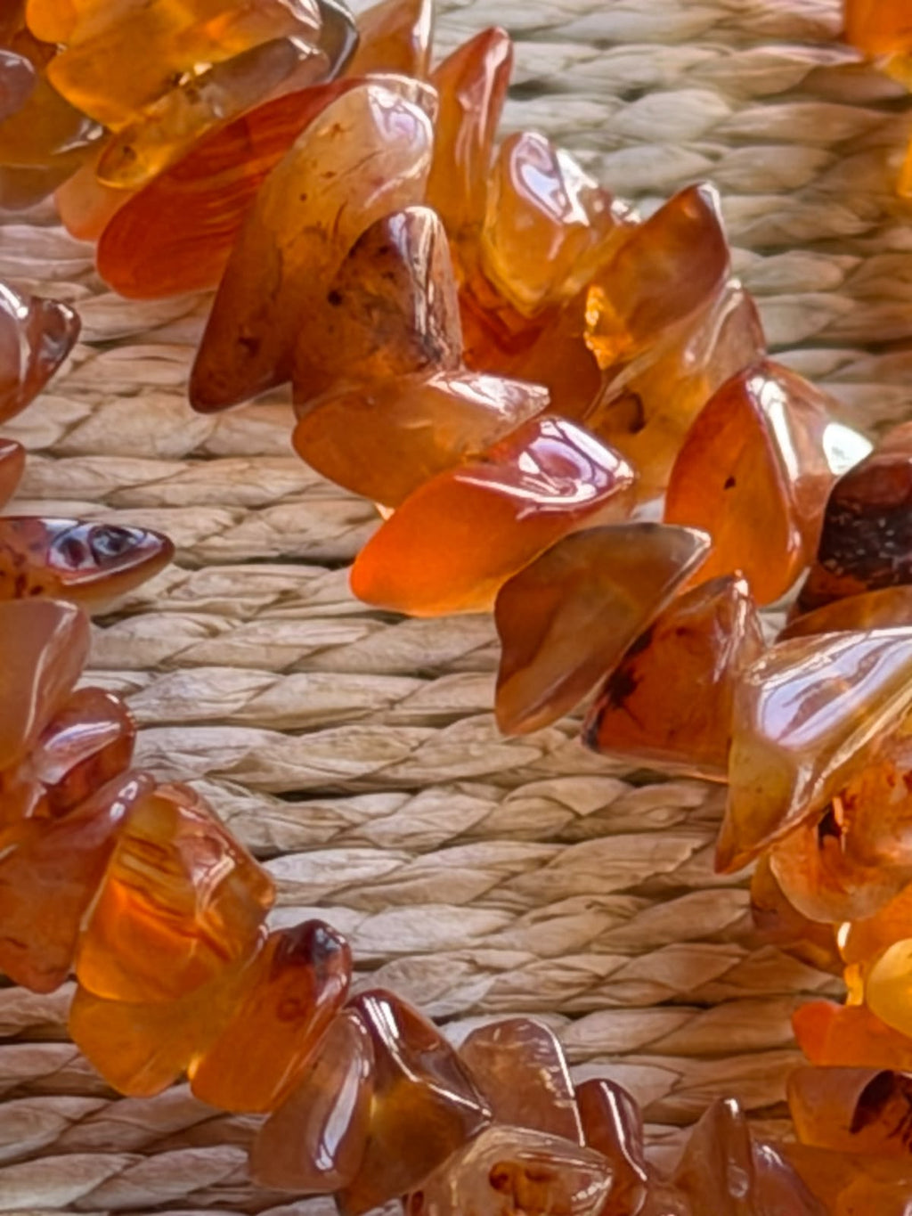Natural carnelian chip necklace full 88cm length displayed on white background