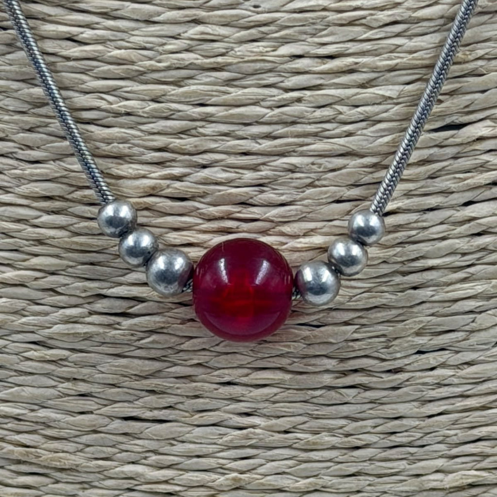 Necklace on display stand - natural background