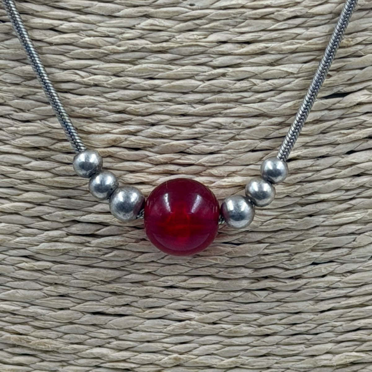 Necklace on display stand - natural background