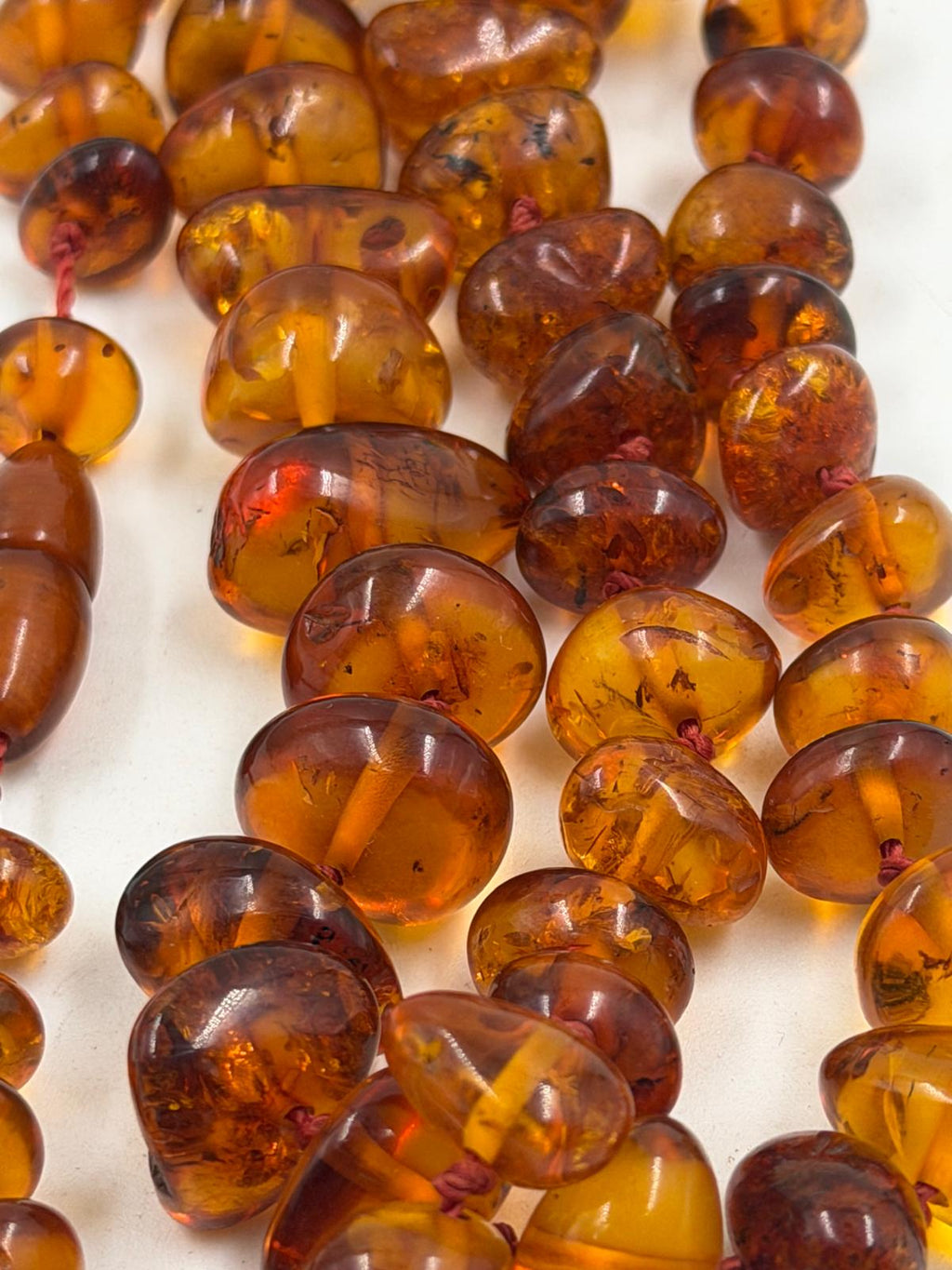 Close-up detail of honey cognac colored beads