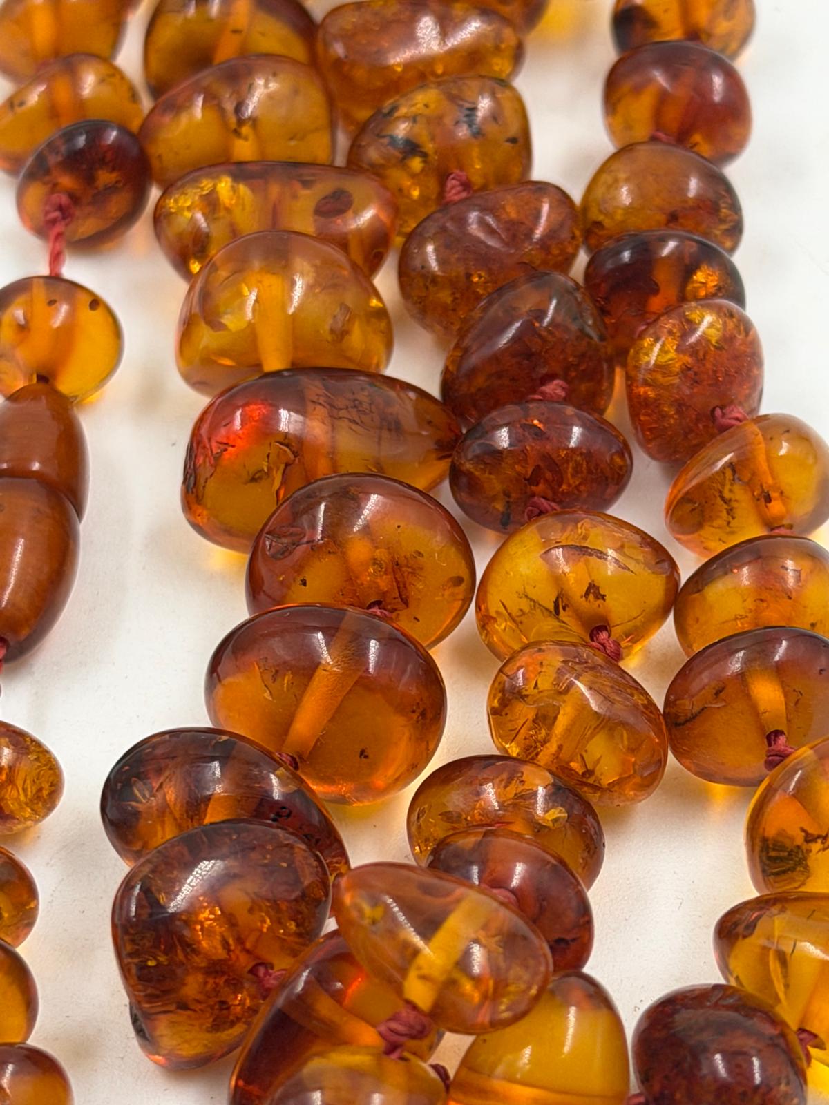 Close-up detail of honey cognac colored beads