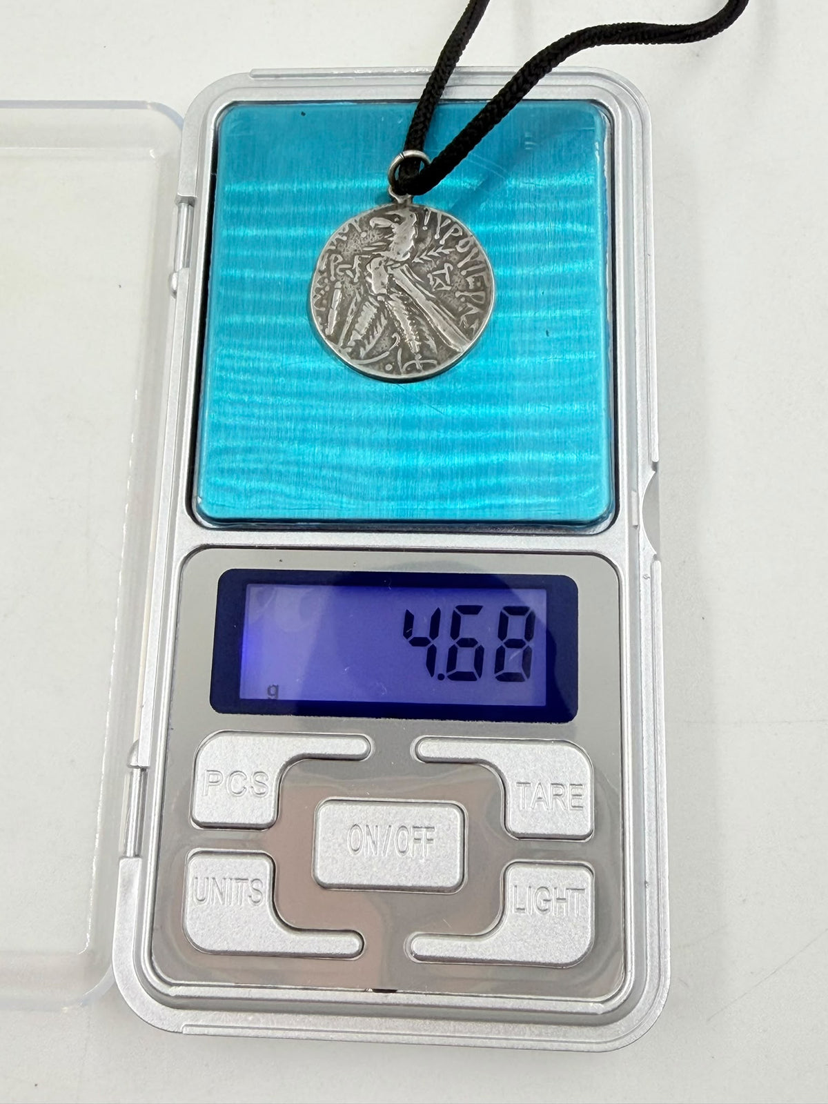 800 silver antique coin pendant close-up on wicker bust