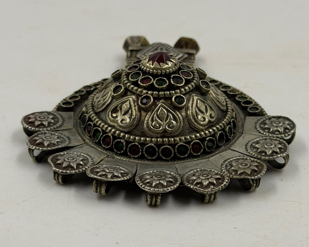 Antique Afghan silver pendant in hand