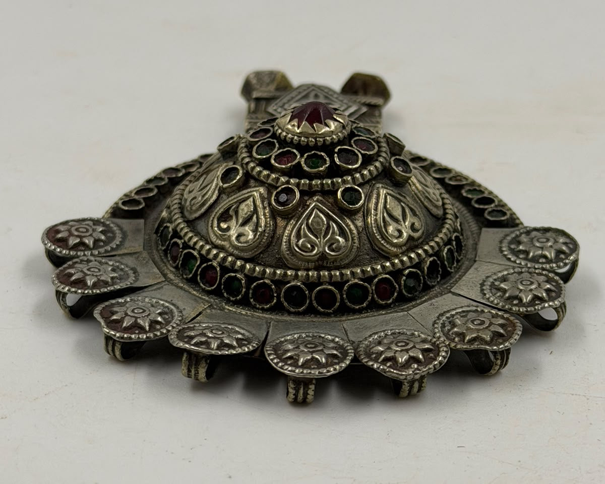 Antique Afghan silver pendant in hand