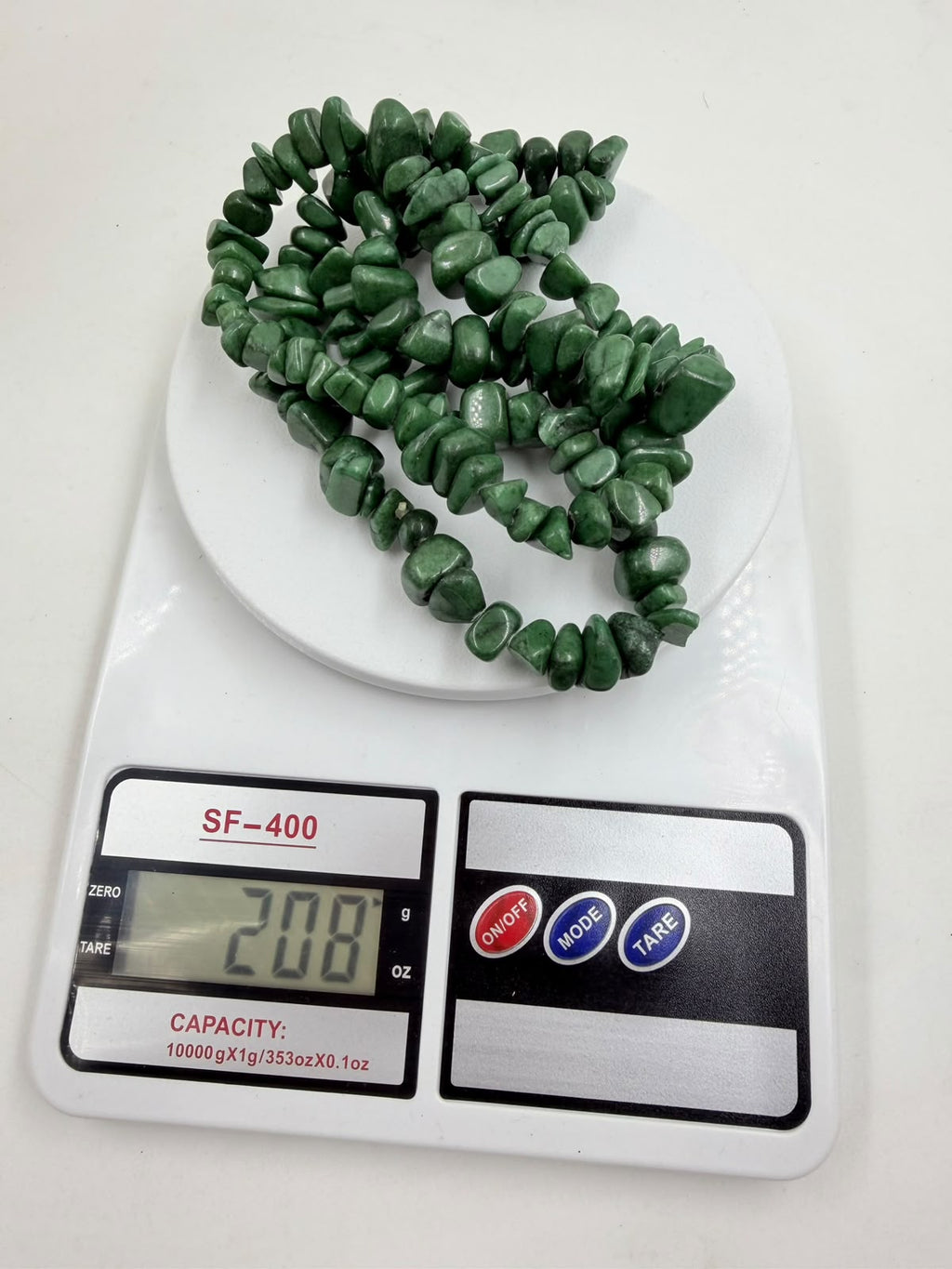Green aventurine chip necklace weight 208 grams on digital scale