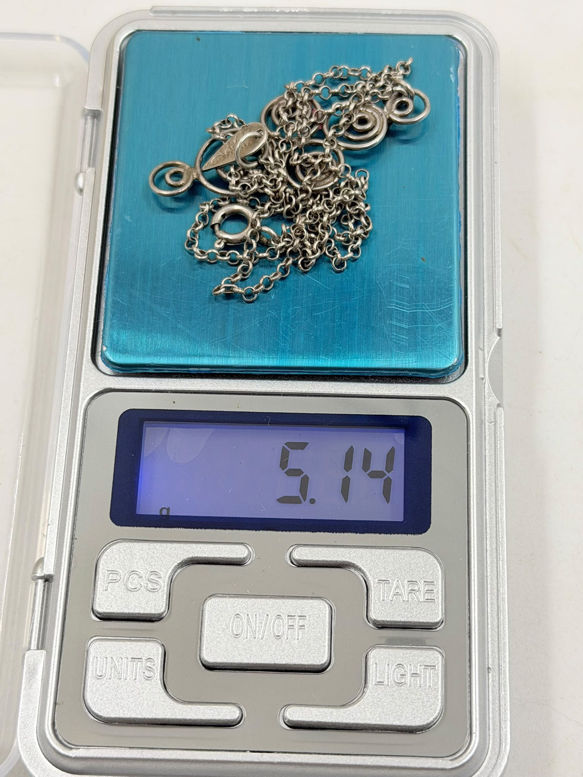 925 sterling silver Celtic spiral pendant detail in hand