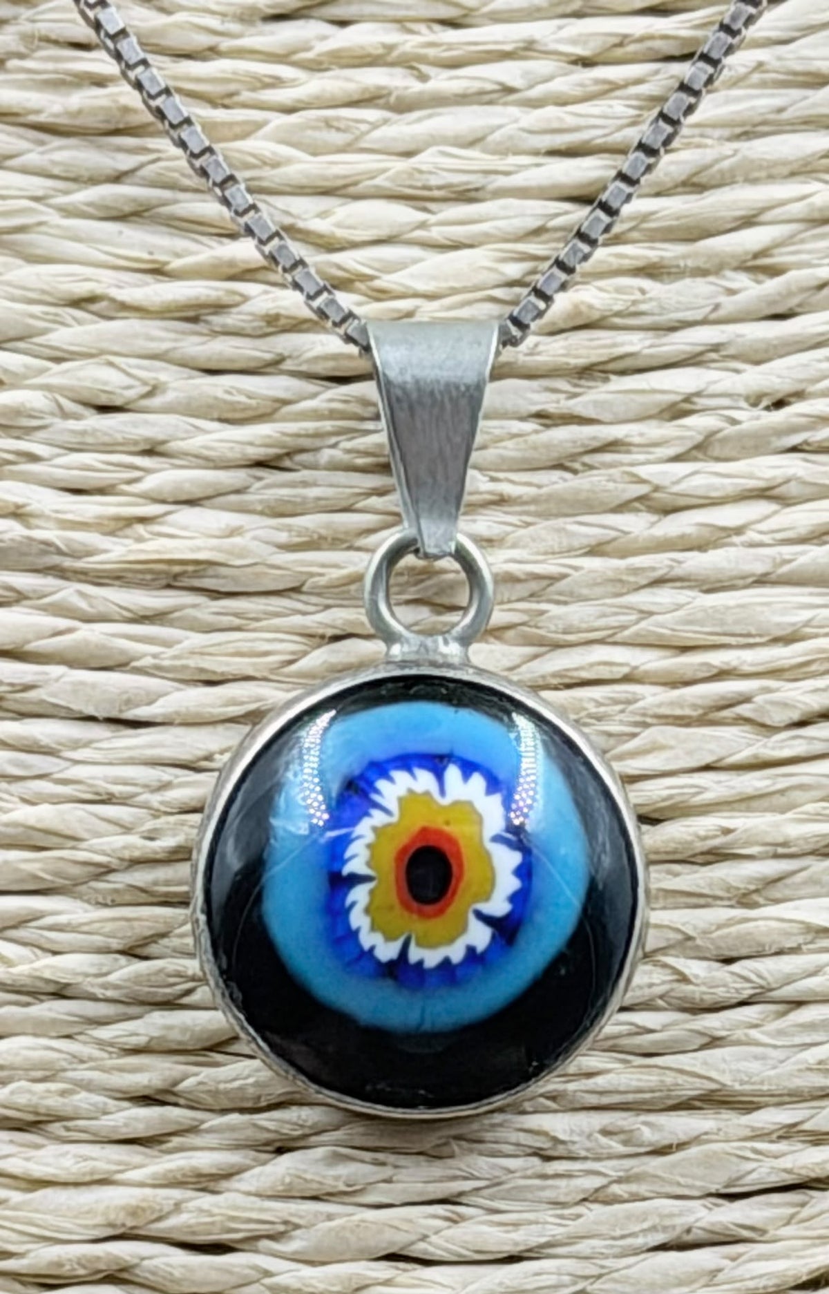 925 Italian sterling silver Millefiori evil eye necklace on white background