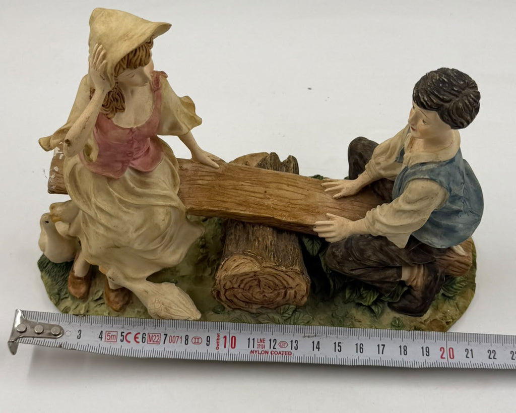 Vintage Victorian resin children seesaw figurine weight 959g on scale