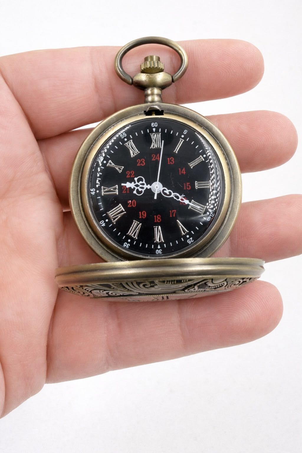 Vintage bronze pocket watch on digital scale showing 37 grams