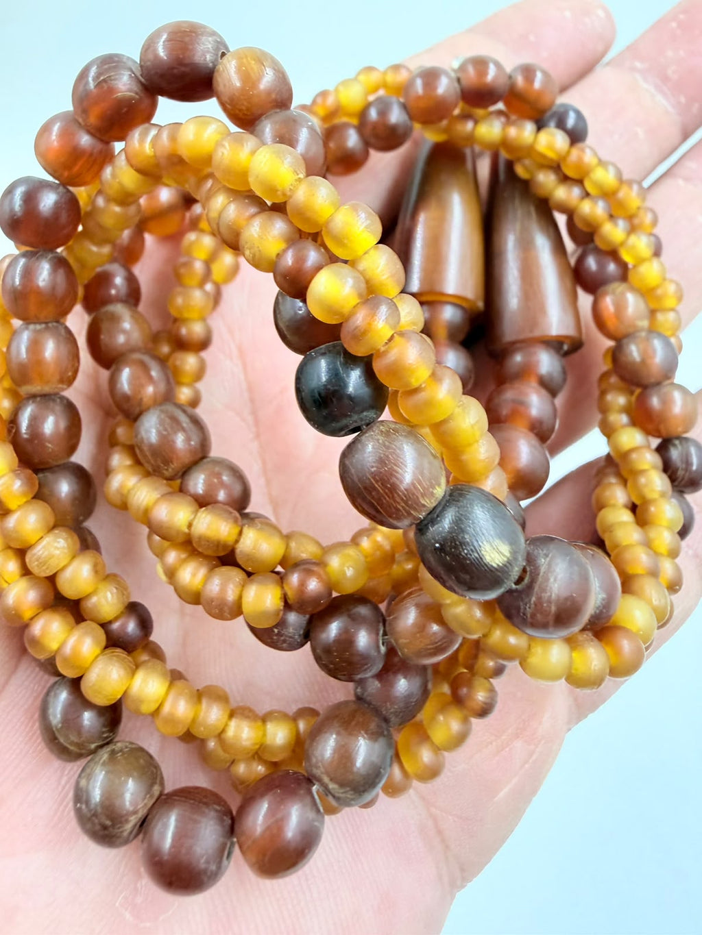 Clasp detail – cone amber end caps with S-hook