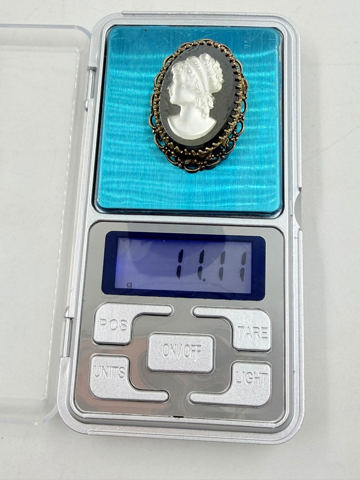 Cameo brooch side angle held in hand