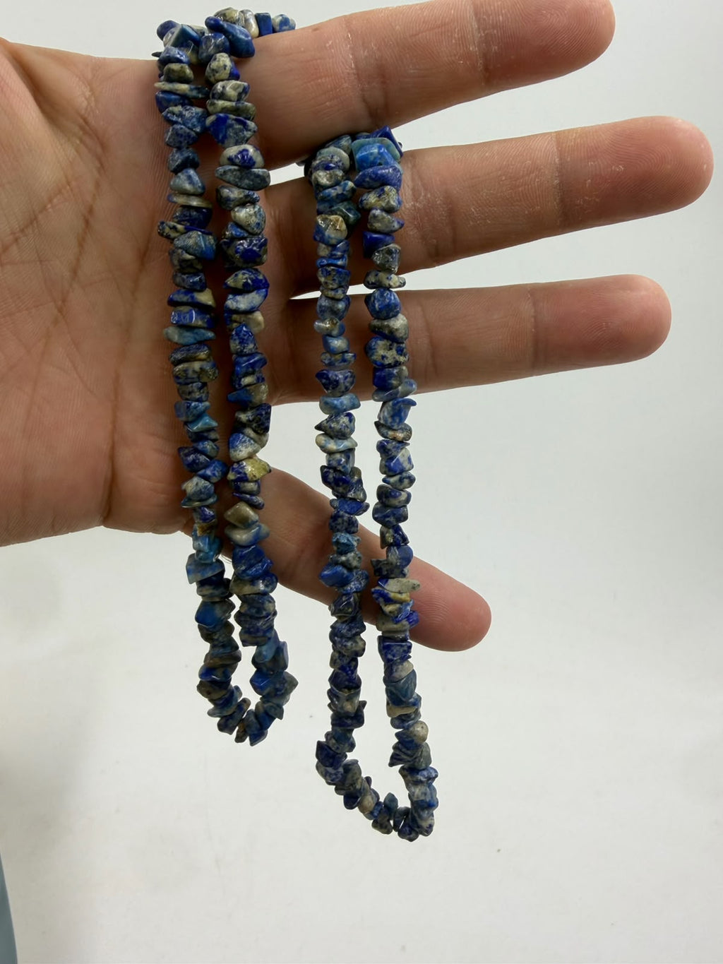 Natural lapis lazuli rondelle disc beads close-up showing polished surface