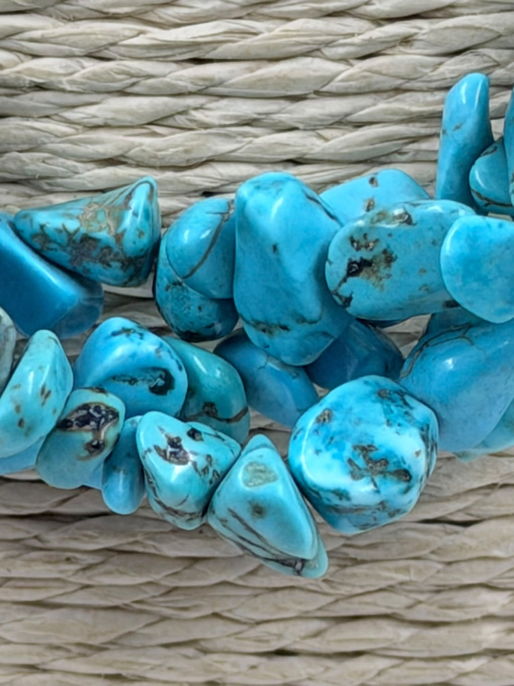 Turquoise necklace on scale showing 80 grams weight