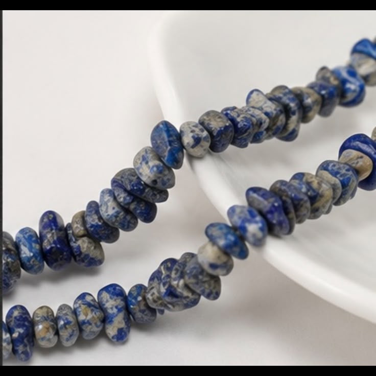 Natural lapis lazuli rondelle beaded necklace close-up showing blue and white pattern