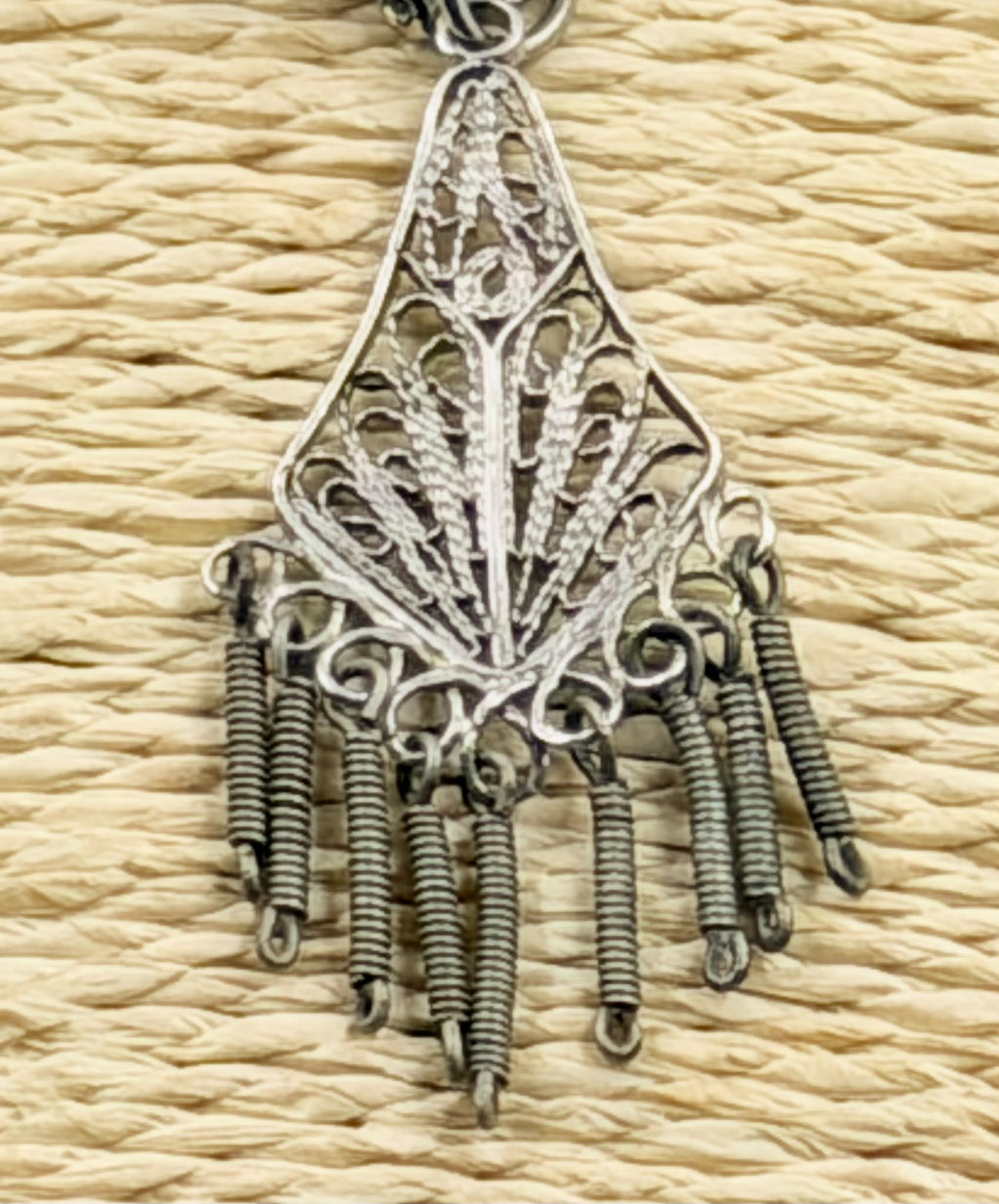 Earrings laid next to ruler showing approx. 6cm total length