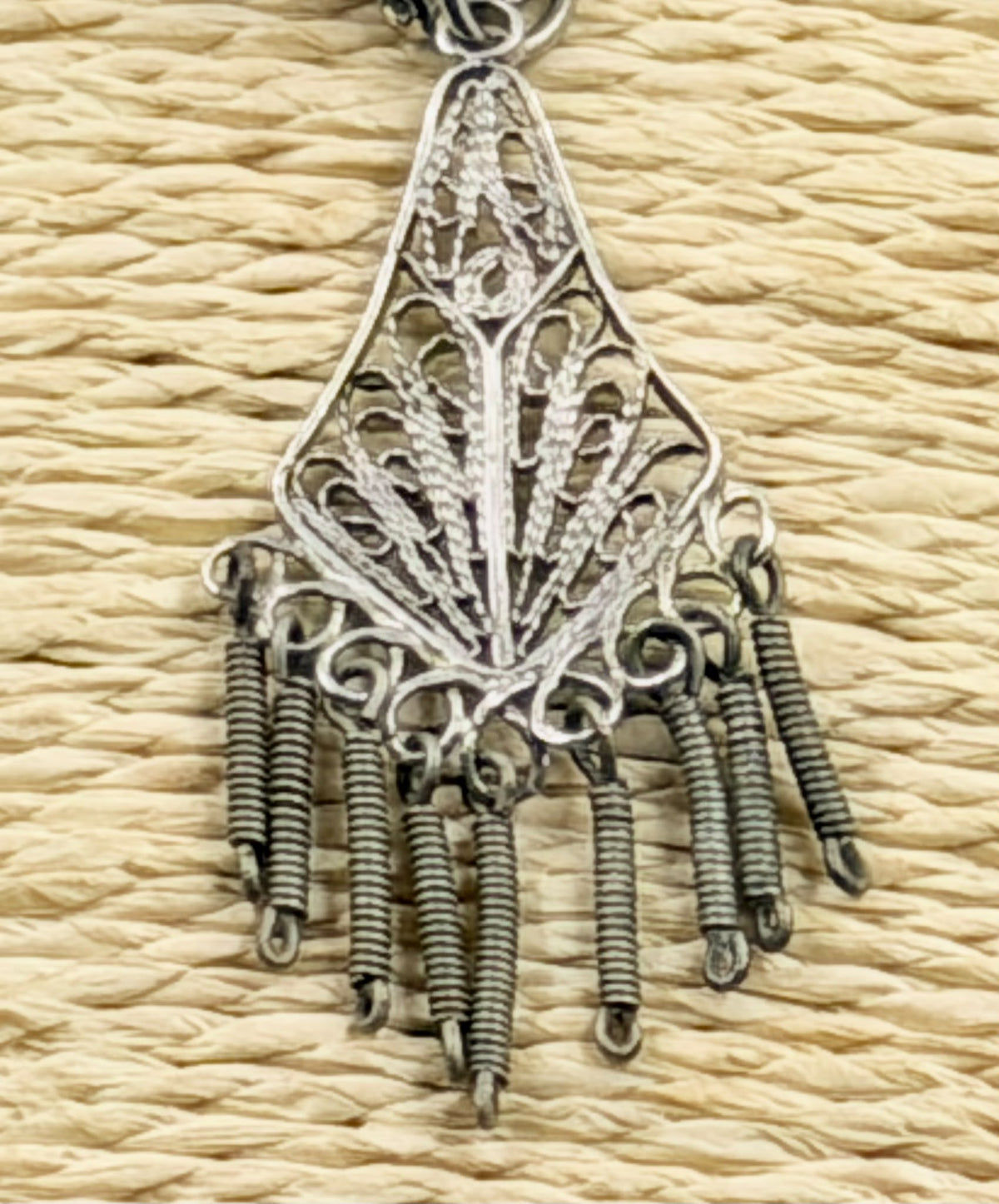 Earrings laid next to ruler showing approx. 6cm total length