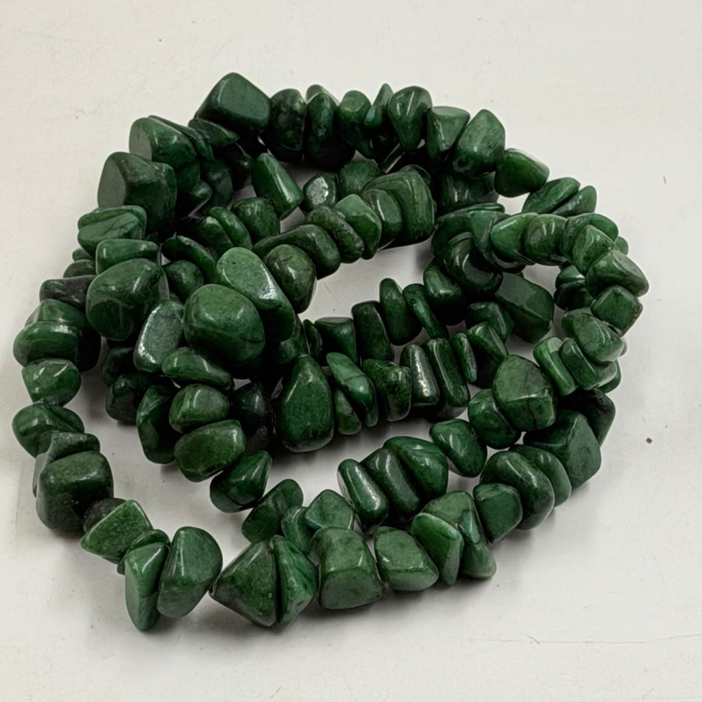 Green aventurine chip necklace displayed on wicker jewelry bust - full length view