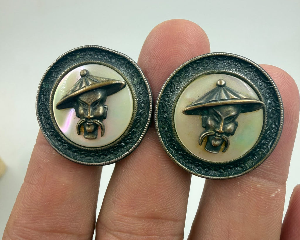 Soviet era cufflinks macro close-up of Asian sage face on mother of pearl