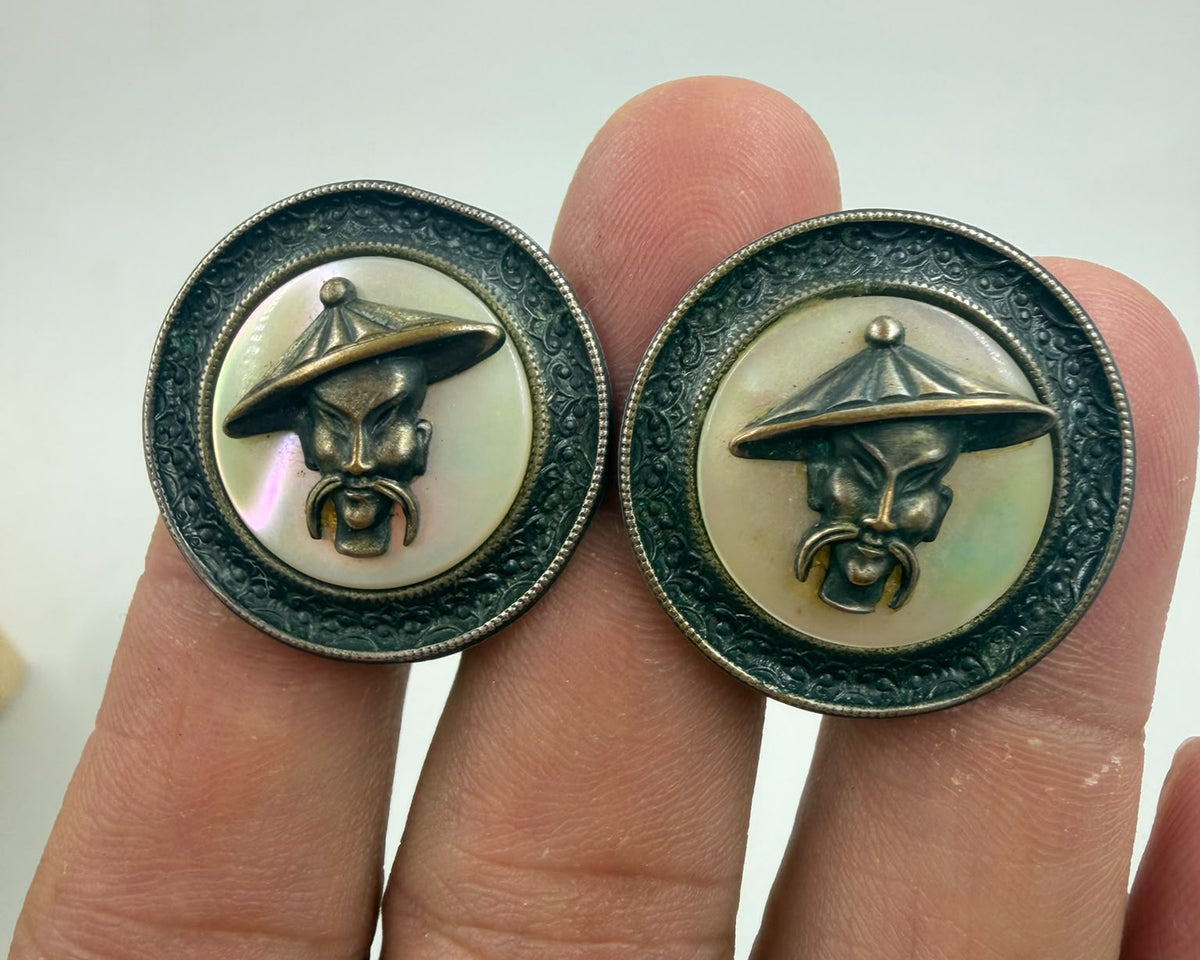 Soviet era cufflinks macro close-up of Asian sage face on mother of pearl