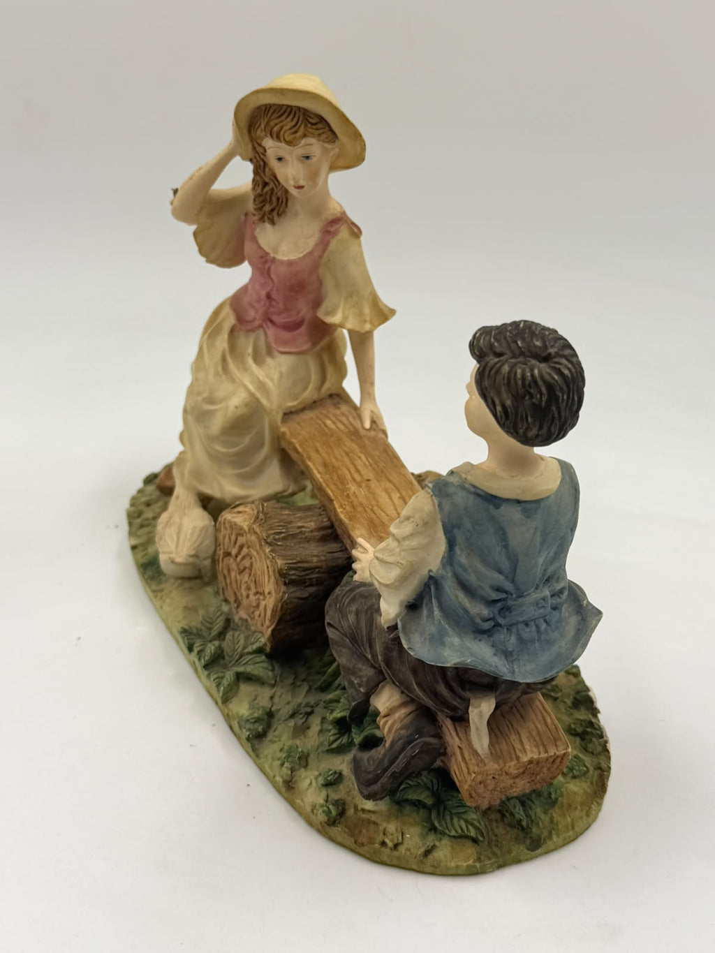 Vintage Victorian resin children seesaw figurine clean front view