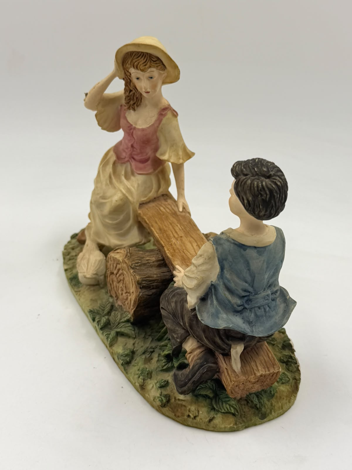 Vintage Victorian resin children seesaw figurine clean front view