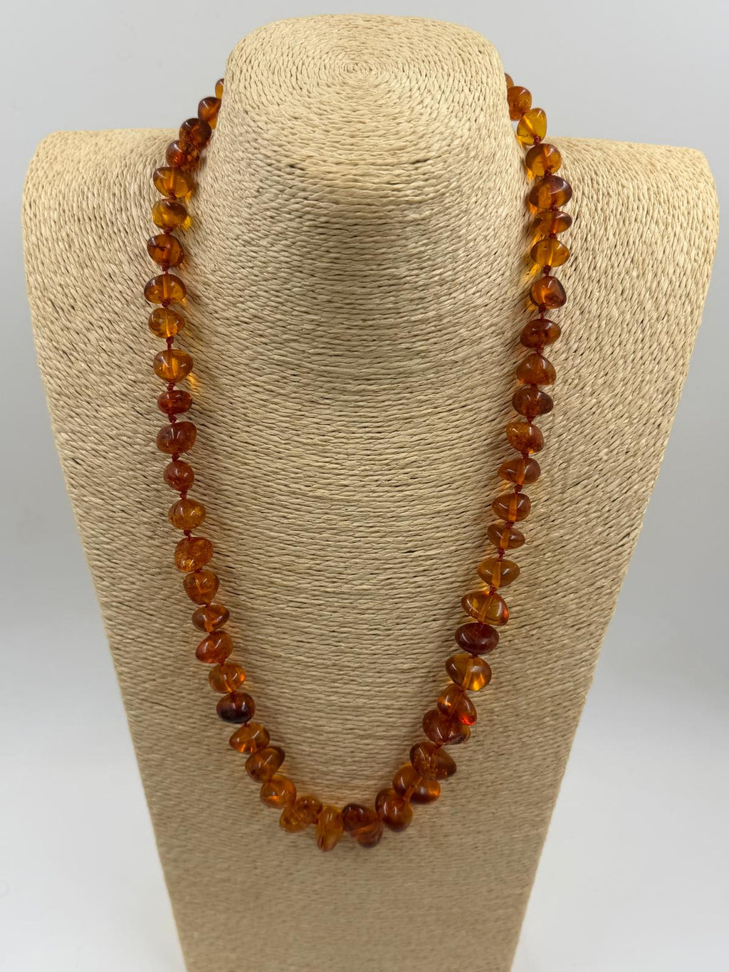 Necklace coiled in hand showing full length