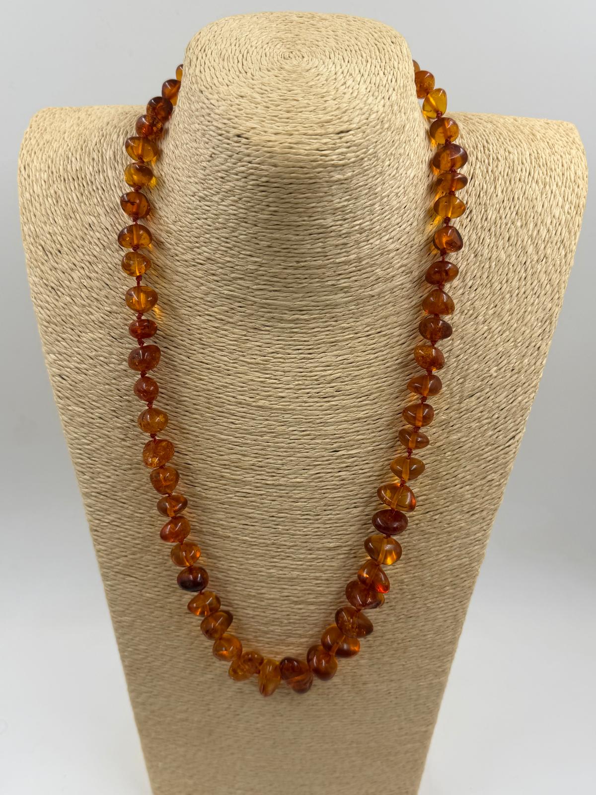 Necklace coiled in hand showing full length
