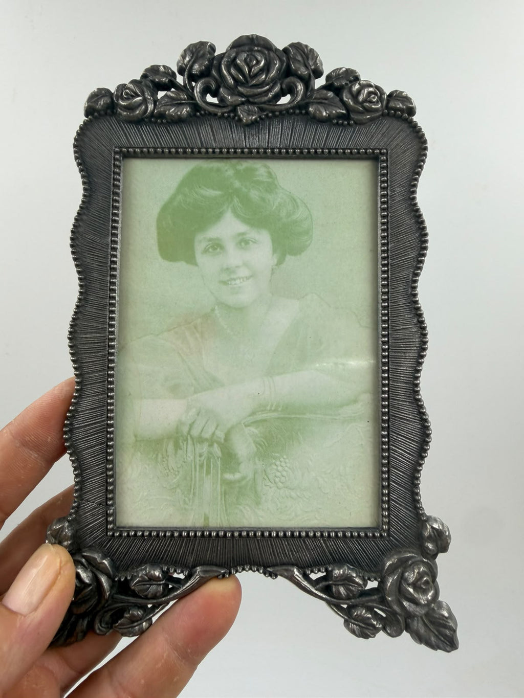 Rectangular pewter photo frame with ruler showing 20cm height