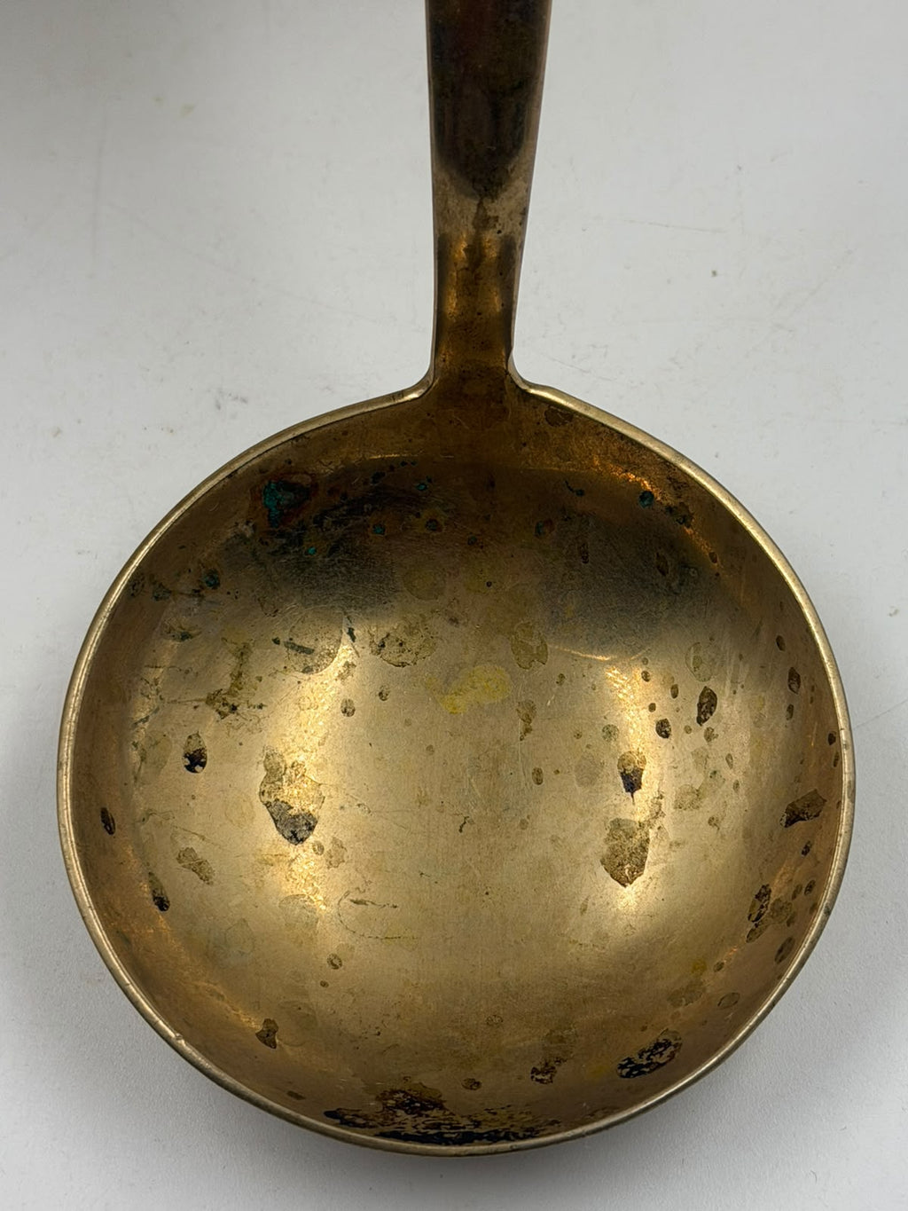 Antique Thai brass ladle with ruler showing 24cm length