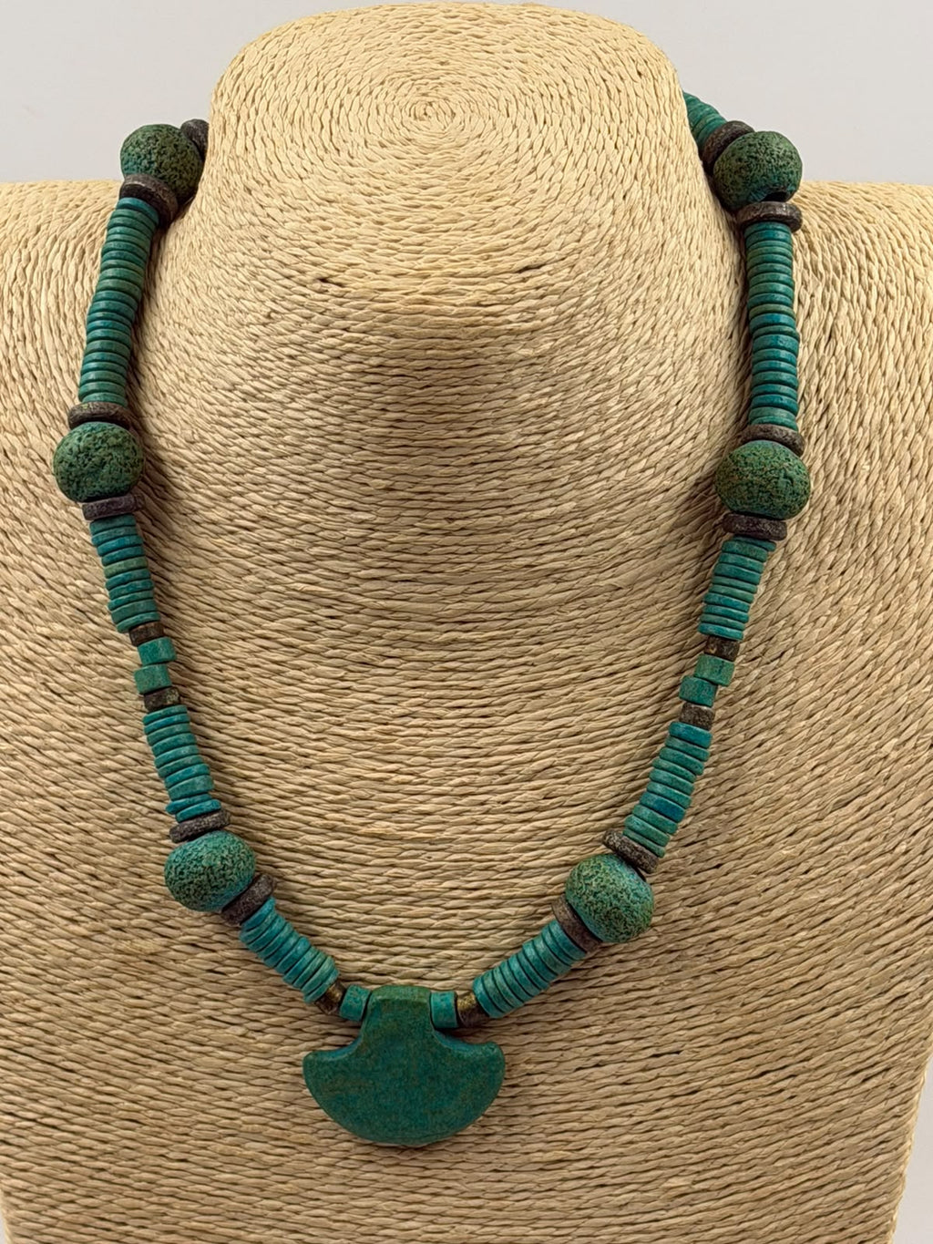 Vintage style turquoise necklace full coiled view showing all elements heishi discs nuggets bronze spacers and fan pendant