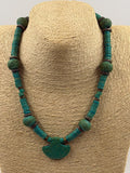 Vintage style turquoise necklace full coiled view showing all elements heishi discs nuggets bronze spacers and fan pendant