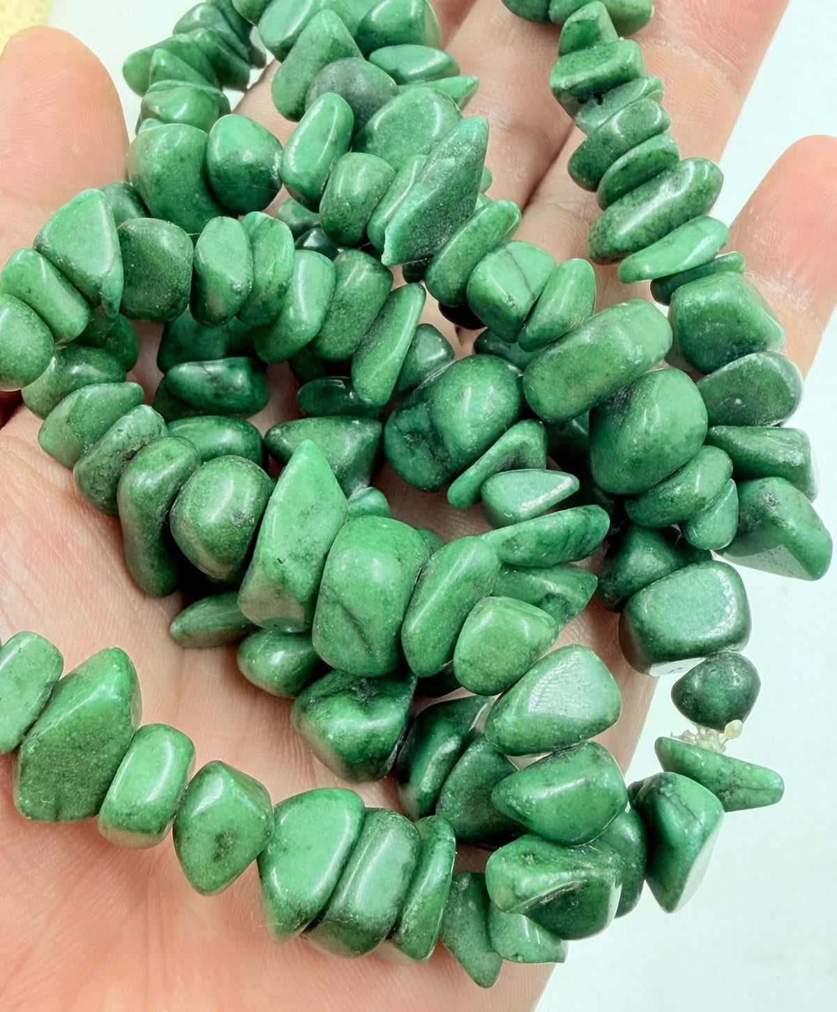Green aventurine chip necklace coiled showing full strand
