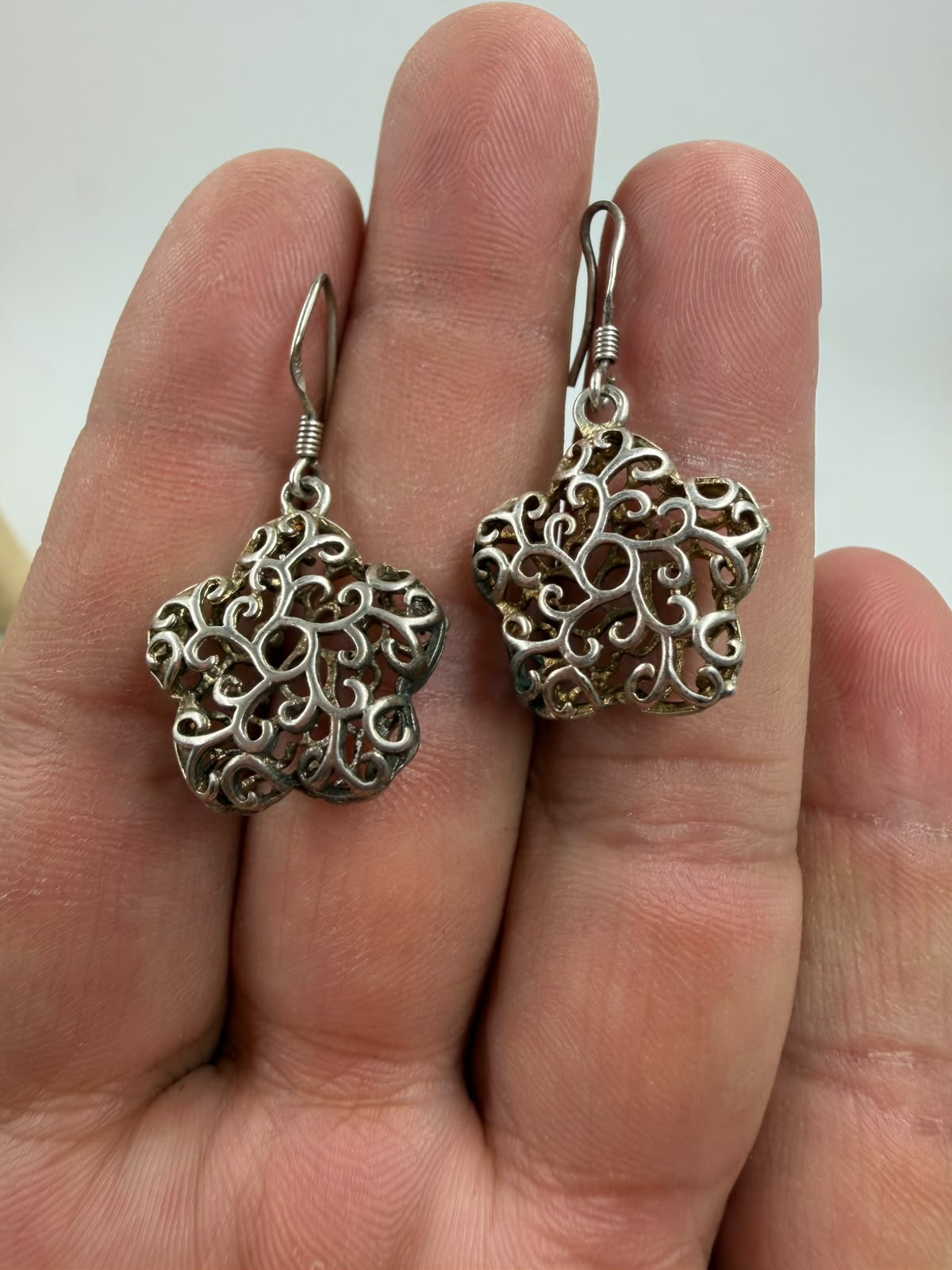 925 silver filigree flower earrings side angle showing 3D depth and volume of filigree dome