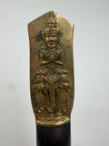 Brass handle with Hindu deity relief figure close-up