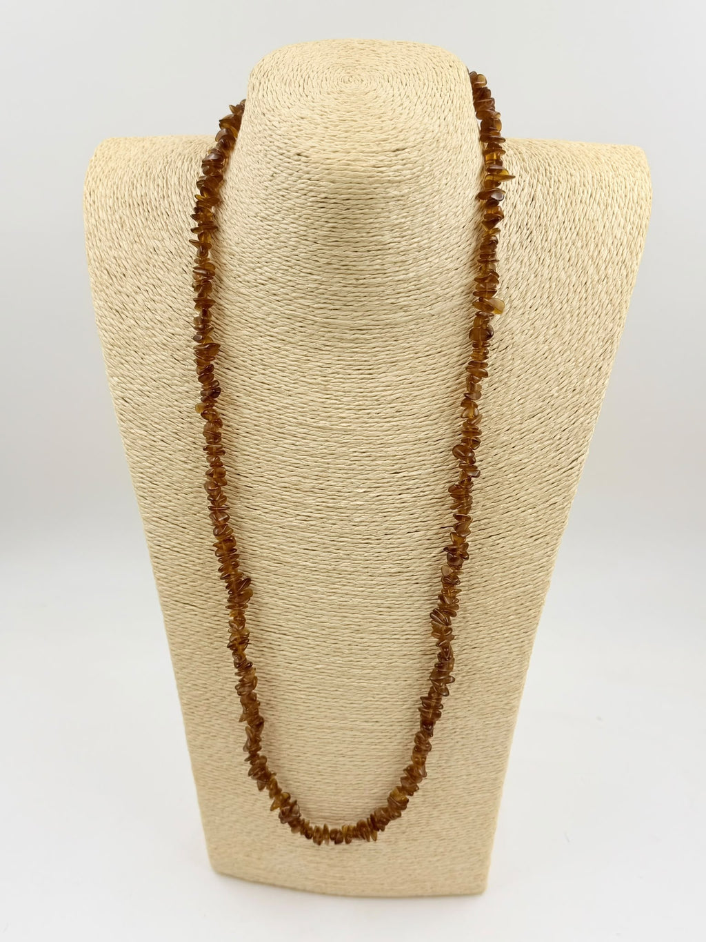 Natural brown agate chip necklace on wicker jewelry bust - double strand close neck view