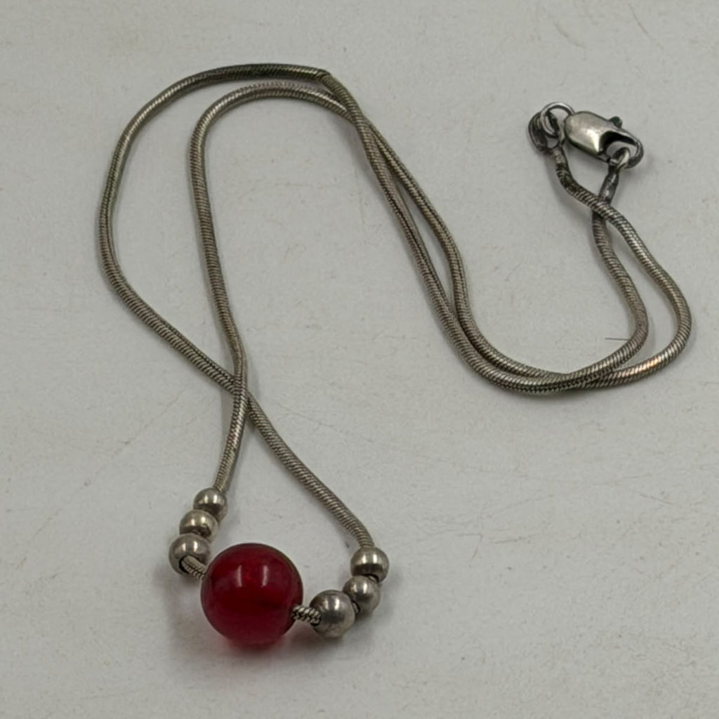 Necklace held in hand showing size and clasp